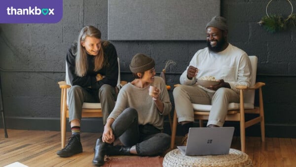 Coworkers collaborating on a sofa