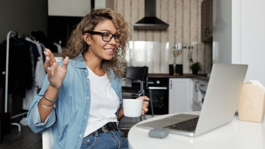 Positive woman working from home