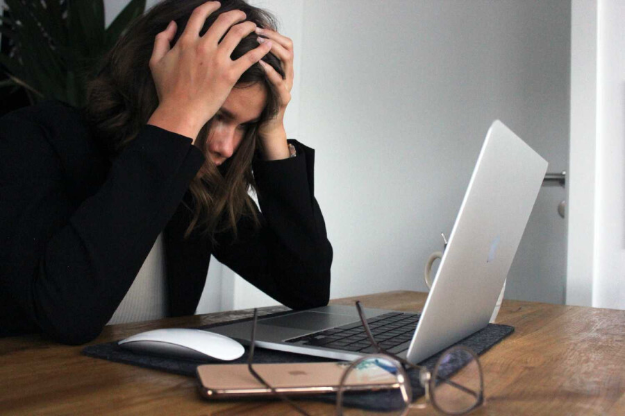 Female getting frustrated with laptop working from home