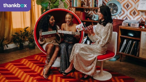 Women Opening Gifts Together