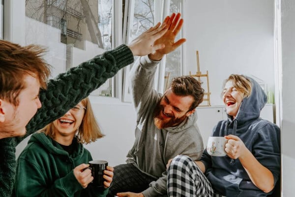 A group of people laughing and sharing a joke