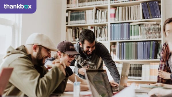 Office workers checking an online leaving card