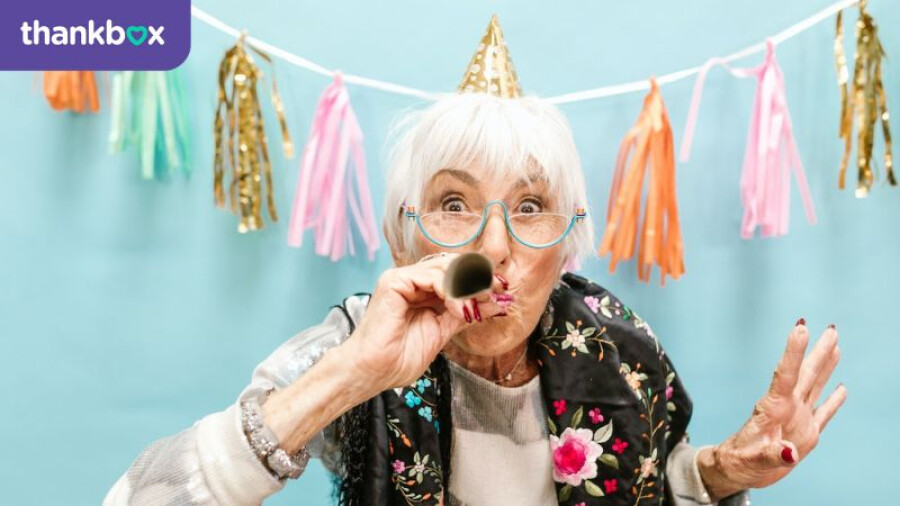 Elderly Woman Blowing a Party Horn