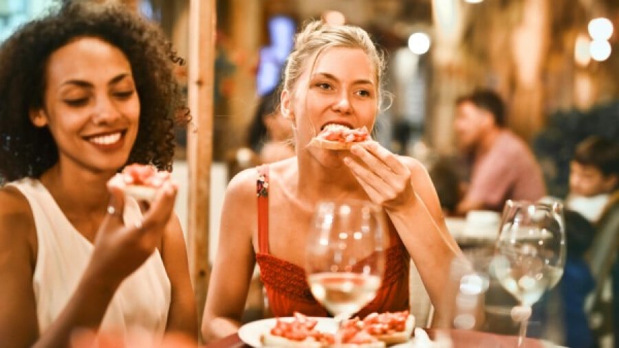 Women eating bruschetta