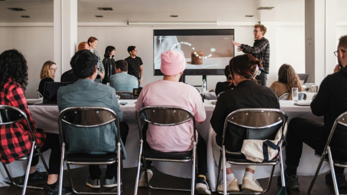 Man giving a presentation to a group of people