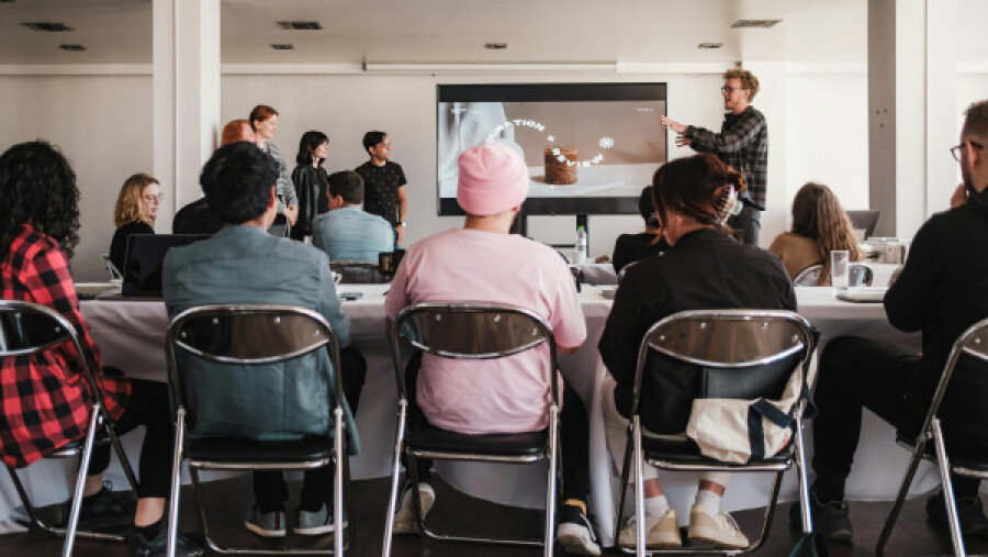 Man giving a presentation to a group of people