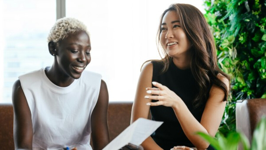 Diverse cheerful colleagues having a conversation