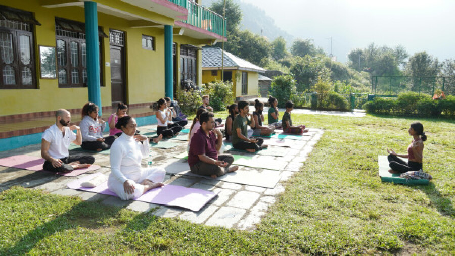 People practising yoga outside