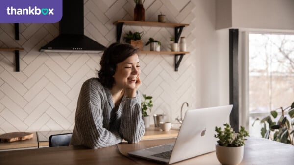 Smiling woman in an online meeting