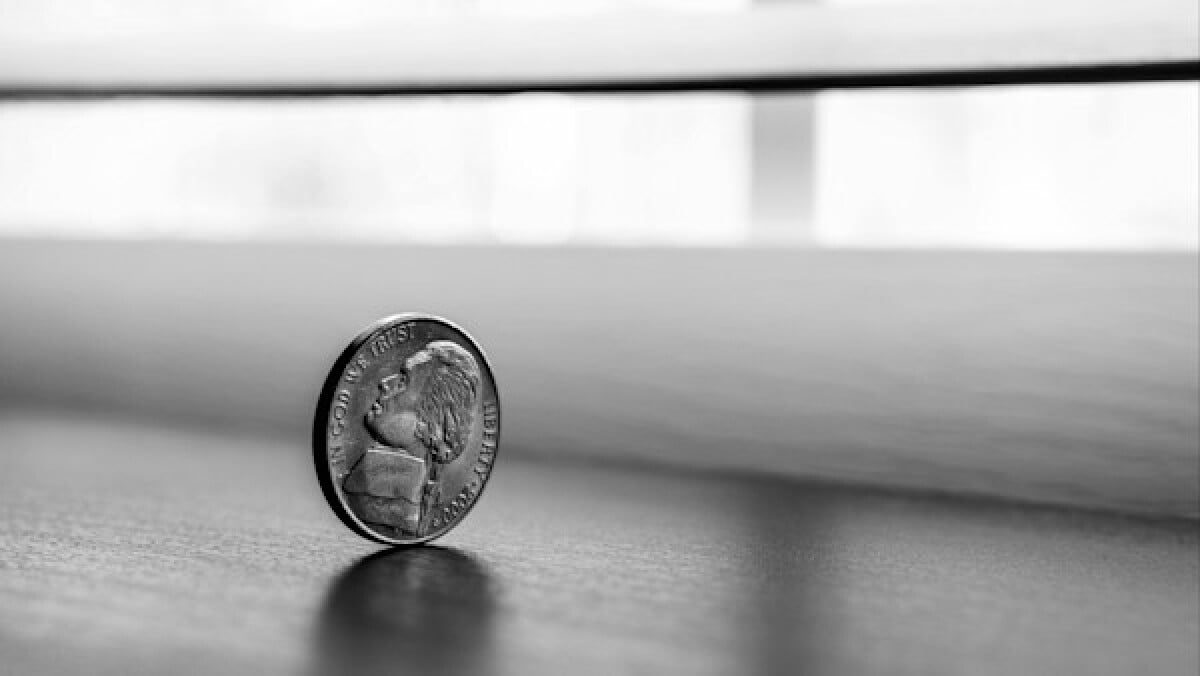Monochrome Photography of Round Silver Coin