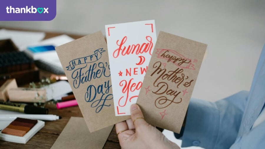 Person Holding Greeting Cards
