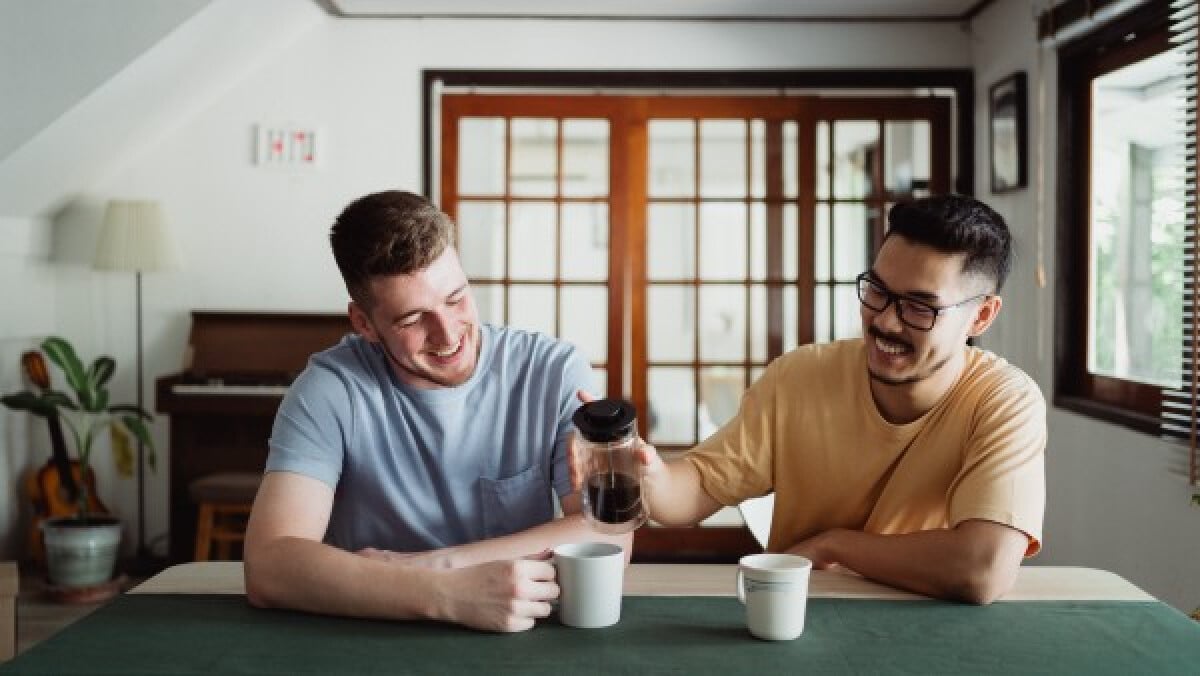 Cheerful men drinking coffee