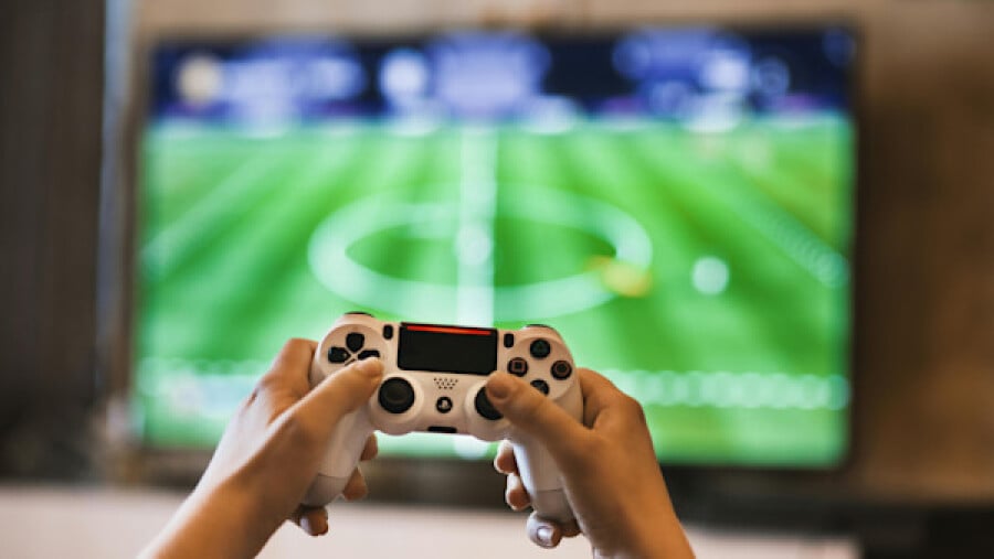 Person holding a game controller