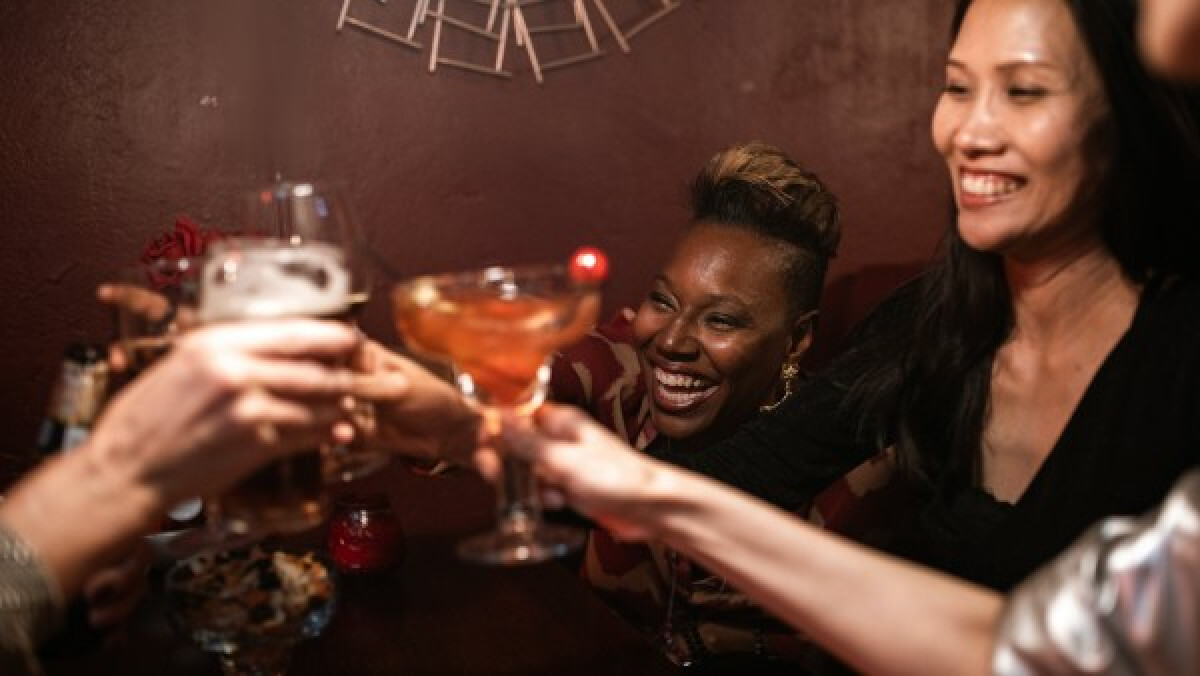 Happy friends toasting their drinks