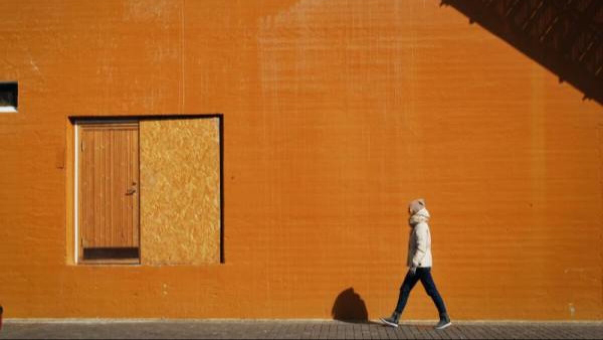 Person Walking on Sidewalk