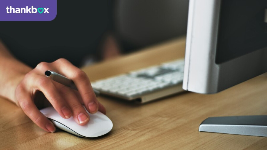 Person Holding Apple Magic Mouse
