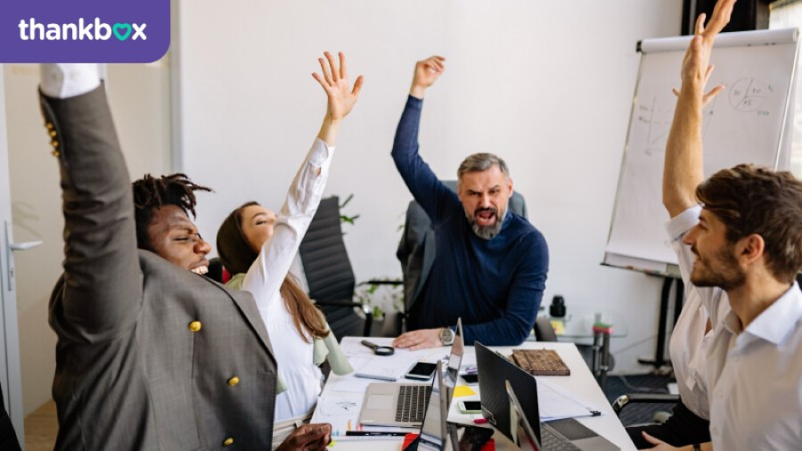 Team celebrating in an office