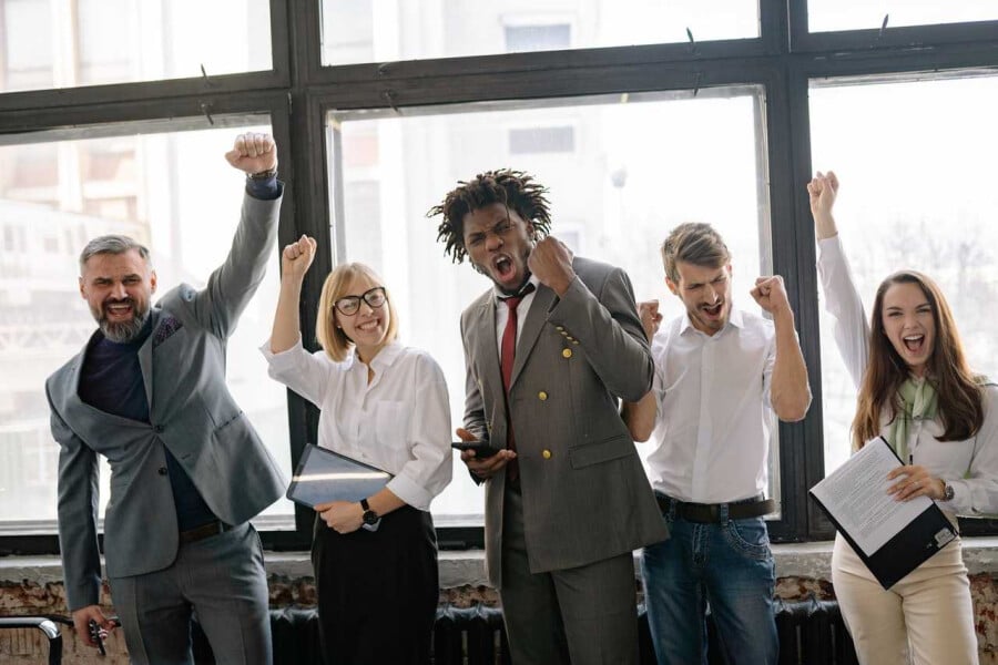 co-workers celebrating a colleague on their work anniversary