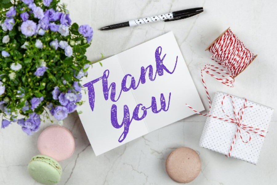 An image highlighting a thank you card and gift